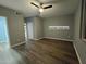 Empty Primary bedroom with hardwood floors and a ceiling fan at 770 S Pinal Dr, Apache Junction, AZ 85120