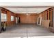 Spacious, unfinished two-car garage, ready for customization with ample room for vehicles and storage at 7713 E Mawson Rd, Mesa, AZ 85207