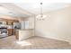 Bright kitchen and dining area with stainless steel appliances, granite countertops, and tile flooring at 869 E Waterview Pl, Chandler, AZ 85249