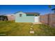 A well-maintained shed with a light blue painted exterior complements the landscaped backyard at 904 W Juanita Ave, Mesa, AZ 85210