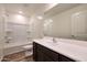 Well-lit bathroom featuring a tub with shower, toilet and vanity with dark cabinets at 1082 W 20Th St, Florence, AZ 85132