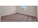 Bright bedroom featuring carpet, light walls and window offering a comfortable living space at 1082 W 20Th St, Florence, AZ 85132