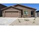 Charming single-story home with a low maintenance front yard and an attached two-car garage at 1082 W 20Th St, Florence, AZ 85132