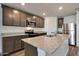 Well-equipped kitchen featuring an island, granite countertops, and sleek stainless steel appliances at 1082 W 20Th St, Florence, AZ 85132