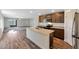 Contemporary kitchen boasting an island, stainless steel appliances, and a seamless flow to the living area at 1082 W 20Th St, Florence, AZ 85132