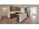 Modern kitchen with granite countertops, stainless steel appliances, and an island with seating at 1082 W 20Th St, Florence, AZ 85132