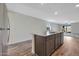 Bright kitchen island with granite countertop and view of the living space, creating an open layout at 1082 W 20Th St, Florence, AZ 85132