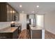Stylish kitchen showcasing granite counters, stainless steel appliances, and a functional center island at 1082 W 20Th St, Florence, AZ 85132