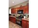A kitchen featuring wood cabinets and stainless steel oven at 10916 E Cholla Rd, Mesa, AZ 85207