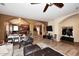 Open-concept living room offering hardwood floors, archways, and connectivity to other living spaces at 10916 E Cholla Rd, Mesa, AZ 85207