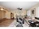 Spacious living area with hardwood floors, ceiling fan, and comfortable seating at 10916 E Cholla Rd, Mesa, AZ 85207