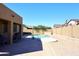 Backyard featuring a refreshing swimming pool, large patio, and manicured landscaping at 10916 E Cholla Rd, Mesa, AZ 85207