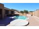 Backyard pool with a large concrete patio area, perfect for entertaining at 10916 E Cholla Rd, Mesa, AZ 85207