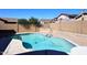 Backyard pool surrounded by a brick patio and privacy fence at 10916 E Cholla Rd, Mesa, AZ 85207