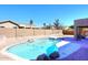 Backyard pool with rock accents, brick patio and privacy fence at 10916 E Cholla Rd, Mesa, AZ 85207