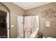 Bathroom featuring a glass enclosed shower with decorative wall art at 10916 E Cholla Rd, Mesa, AZ 85207