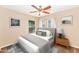 Serene bedroom featuring a plush bed, calming decor, and ample natural light at 10938 W Pierson St, Phoenix, AZ 85037