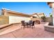 Fully-fenced backyard with custom seating, a water feature, and mature landscaping at 1150 E Liberty Shores Dr, Gilbert, AZ 85234