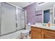 This bathroom features a shower-tub combo with a glass door at 1150 E Liberty Shores Dr, Gilbert, AZ 85234