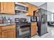 Kitchen with matching black refrigerator, oven, range, and updated cabinets at 1150 E Liberty Shores Dr, Gilbert, AZ 85234