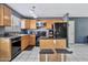 Kitchen with matching black dishwasher, refrigerator, oven, range, and seating at 1150 E Liberty Shores Dr, Gilbert, AZ 85234