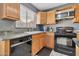 Kitchen with matching black dishwasher, oven, range, and updated cabinets at 1150 E Liberty Shores Dr, Gilbert, AZ 85234