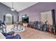 Spacious living room with vaulted ceilings, tile floors, and a unique collection of guitars at 1150 E Liberty Shores Dr, Gilbert, AZ 85234