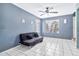 Comfortable living room featuring tile floors, a ceiling fan, and a large window for ample light at 1150 E Liberty Shores Dr, Gilbert, AZ 85234