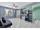 View of an open living space featuring a large window, ceiling fan, and tile floors at 1150 E Liberty Shores Dr, Gilbert, AZ 85234