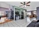 Open living space with tile floors, a ceiling fan, and a neutral color palette at 1150 E Liberty Shores Dr, Gilbert, AZ 85234