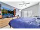 This bedroom has a large screen TV and a ceiling fan at 1150 E Liberty Shores Dr, Gilbert, AZ 85234