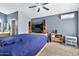 This bedroom has a large screen TV and an A/C unit at 1150 E Liberty Shores Dr, Gilbert, AZ 85234