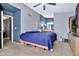 This main bedroom has a purple accent wall and en-suite bathroom at 1150 E Liberty Shores Dr, Gilbert, AZ 85234