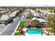 Inviting community pool and outdoor seating with well-maintained landscaping and palm trees at 1150 E Liberty Shores Dr, Gilbert, AZ 85234
