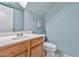 This powder room has white fixtures and a mirrored vanity at 1150 E Liberty Shores Dr, Gilbert, AZ 85234