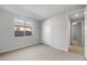 Bright bedroom with a large window, neutral carpet, and a closet at 13538 W Calle De Baca --, Peoria, AZ 85383