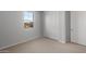 Bright, neutral carpeted bedroom with window and closet at 13538 W Calle De Baca --, Peoria, AZ 85383