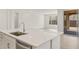 Bright kitchen island with quartz countertop and stainless steel sink at 13538 W Calle De Baca --, Peoria, AZ 85383