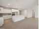 Open-concept kitchen with white cabinetry, a large island, and stainless appliances at 13538 W Calle De Baca --, Peoria, AZ 85383