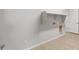 Spacious laundry room with hookups, storage, and access to the garage at 13538 W Calle De Baca --, Peoria, AZ 85383