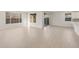 Bright living room featuring neutral walls, wood-look flooring, and large windows at 13538 W Calle De Baca --, Peoria, AZ 85383