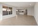 Spacious living room showcasing wood-look flooring and view of kitchen at 13538 W Calle De Baca --, Peoria, AZ 85383
