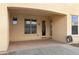 Back patio area with an outdoor hose, providing a convenient space for relaxation and yard work at 1358 E Angie St, Casa Grande, AZ 85122
