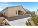 Exterior home backyard view with expansive patio, grass and desert landscaping under a sunny sky at 1358 E Angie St, Casa Grande, AZ 85122