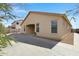 Backyard featuring a covered patio, hardscape, and low-maintenance desert landscaping at 1358 E Angie St, Casa Grande, AZ 85122