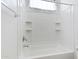 White bathtub with tile surround and shower head fixture at 1358 E Angie St, Casa Grande, AZ 85122