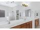 Primary bathroom featuring double sinks and a glass walk-in shower at 1358 E Angie St, Casa Grande, AZ 85122
