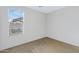Bright bedroom featuring neutral walls, carpet flooring, and window with natural light at 1358 E Angie St, Casa Grande, AZ 85122