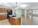 Modern kitchen island features a sink and views into living spaces, perfect for entertaining and Gathering at 1358 E Angie St, Casa Grande, AZ 85122