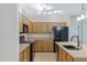 Functional kitchen with plentiful cabinets, modern appliances, and a practical layout designed for efficiency and convenience at 1358 E Angie St, Casa Grande, AZ 85122